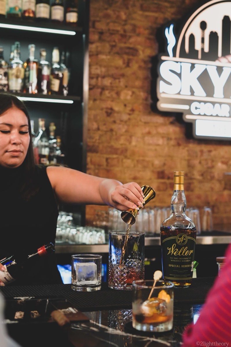 Behind the bar, under the Skyline sign